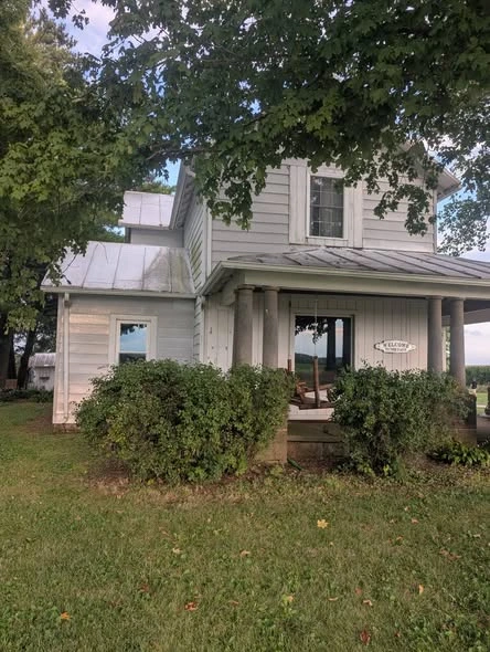 Earlier light-colored exterior of a two-story home