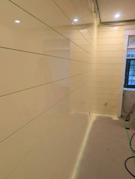 Interior room with painted walls, white trim, and plank flooring