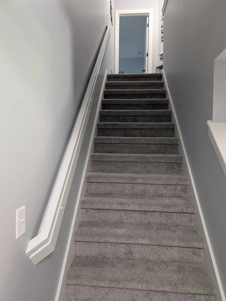 Indoor staircase showing flooring and finish details