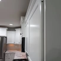 Kitchen cabinetry, cabinet panels, and interior finish details