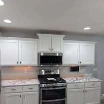 Kitchen cabinetry, cabinet panels, and interior finish details