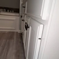 Kitchen cabinetry, cabinet panels, and interior finish details