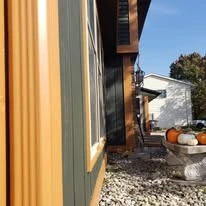 Home exterior showing paint colors, siding, windows, and trim
