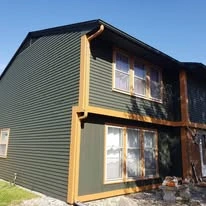 Home exterior showing paint colors, siding, windows, and trim