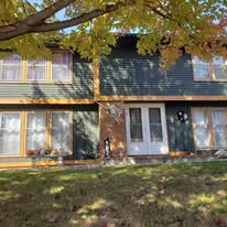 Home exterior showing paint colors, siding, windows, and trim