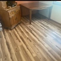 Interior floor project, including existing surfaces and wood-look plank flooring