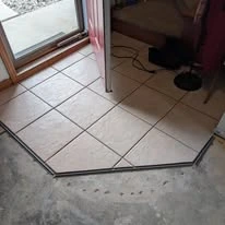 Interior floor project, including existing surfaces and wood-look plank flooring
