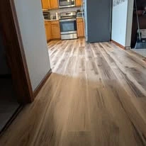 Interior floor project, including existing surfaces and wood-look plank flooring