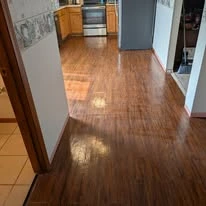 Interior floor project, including existing surfaces and wood-look plank flooring