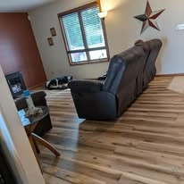 Interior floor project, including existing surfaces and wood-look plank flooring